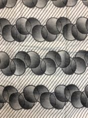 Seersucker african print fabric white with black circles