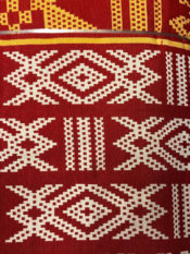 100% Cotton woven kente print fabric in red with white and gold design pattern