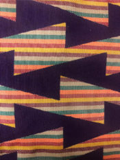 100% cotton woven kente print with purple design patern over multi colored background